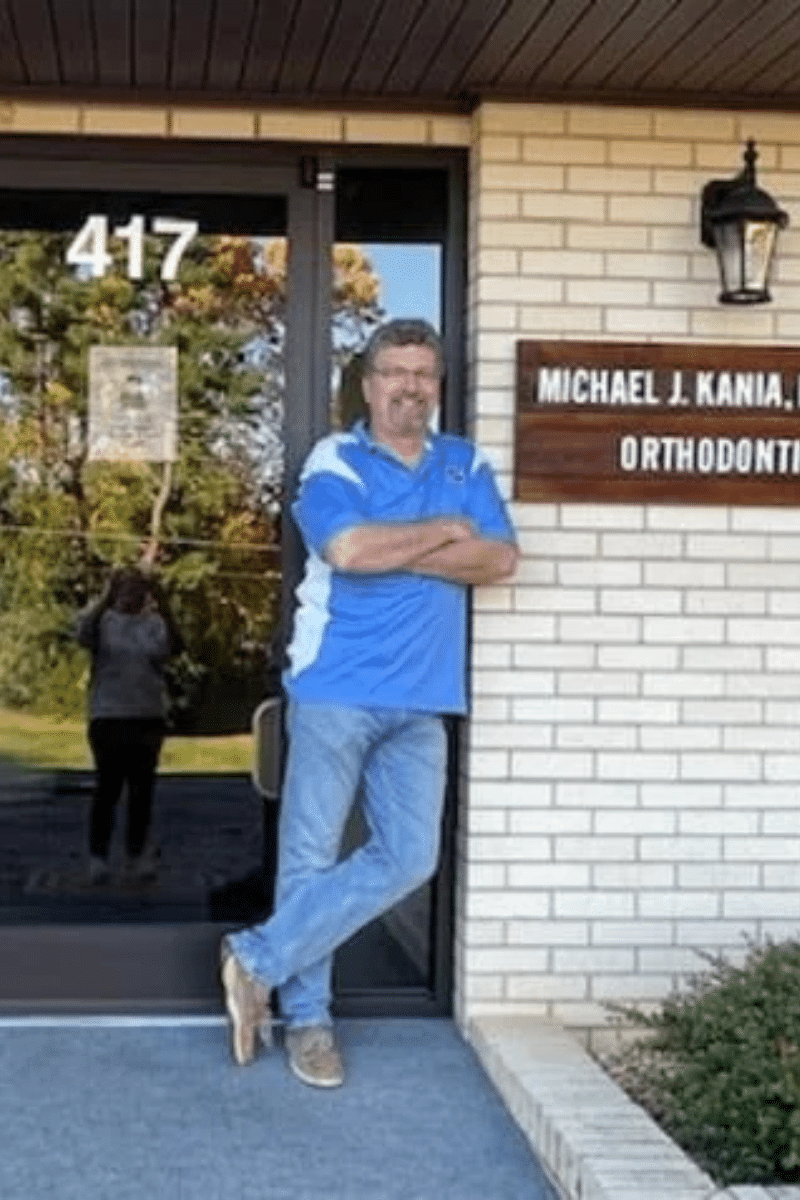 Dr. Michael Kaniaposing outside Kania and Khan Orthodontics office in Asheboro, NC