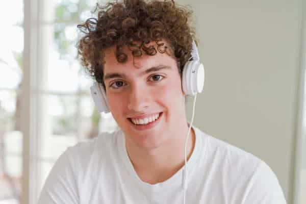 Teen boy smiling after orthodontic treatment in Asheboro, NC
