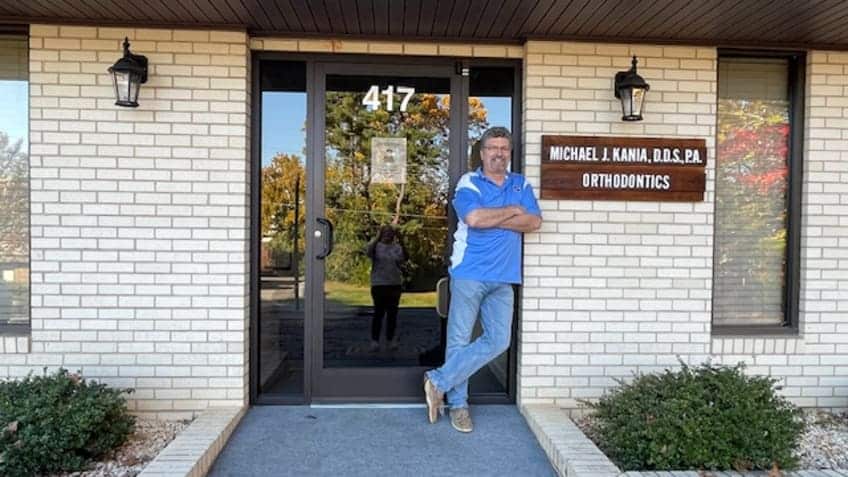 Dr. Michael Kaniaposing outside Kania and Khan Orthodontics office in Asheboro, NC